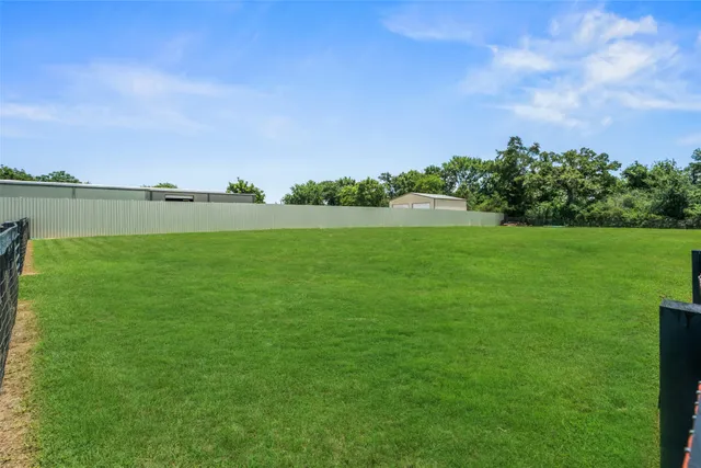 a view of a lake with houses in the back