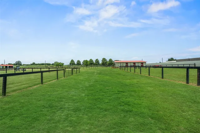 a view of a golf course with a lake view