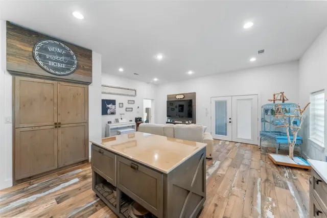 a view of kitchen with cabinets and wooden floor