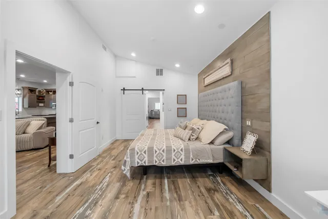 a bedroom with a bed and a walk in closet