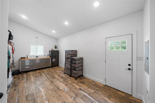 a view of a room with furniture wooden floor and window