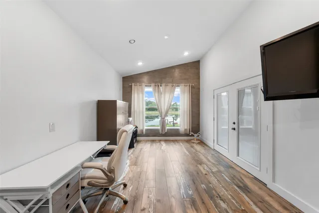 a view of a livingroom with furniture window and wooden floor