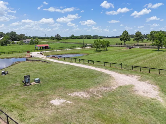 a view of a golf course with a house