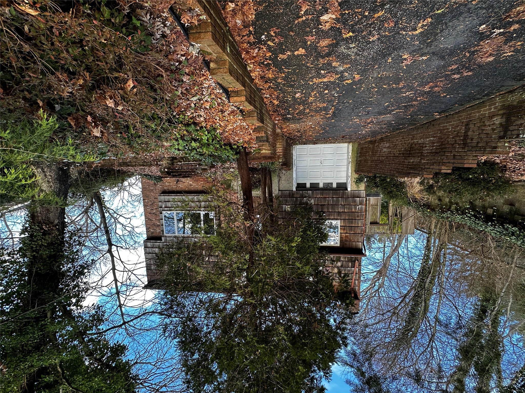 45 Forest Drive Centerport, NY 11721 - Photo 1 of 1 View of front facade with a garage