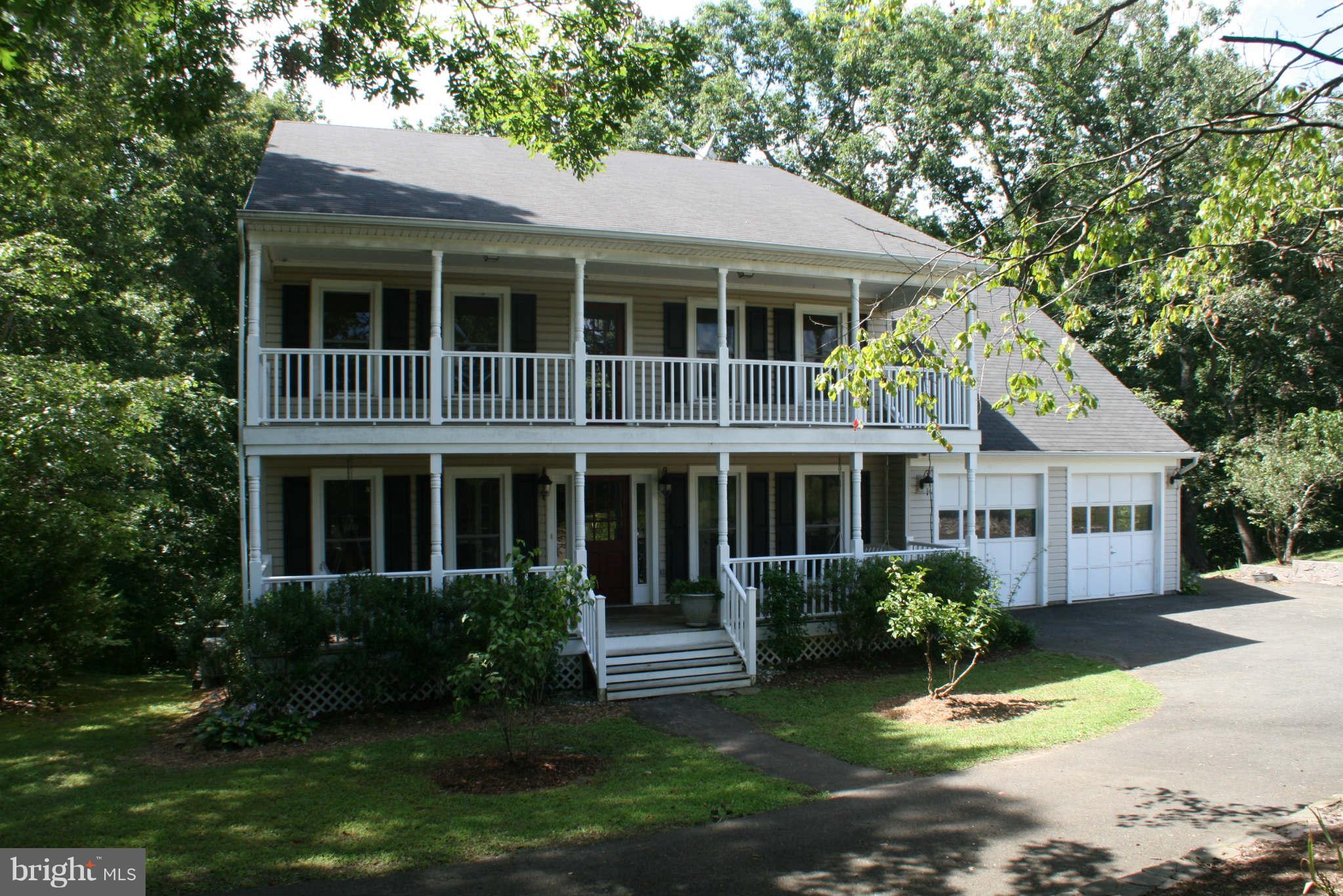 5900 Free State Road Marshall, VA 20115 - Photo 1 of 30 a front view of a house with a garden and trees