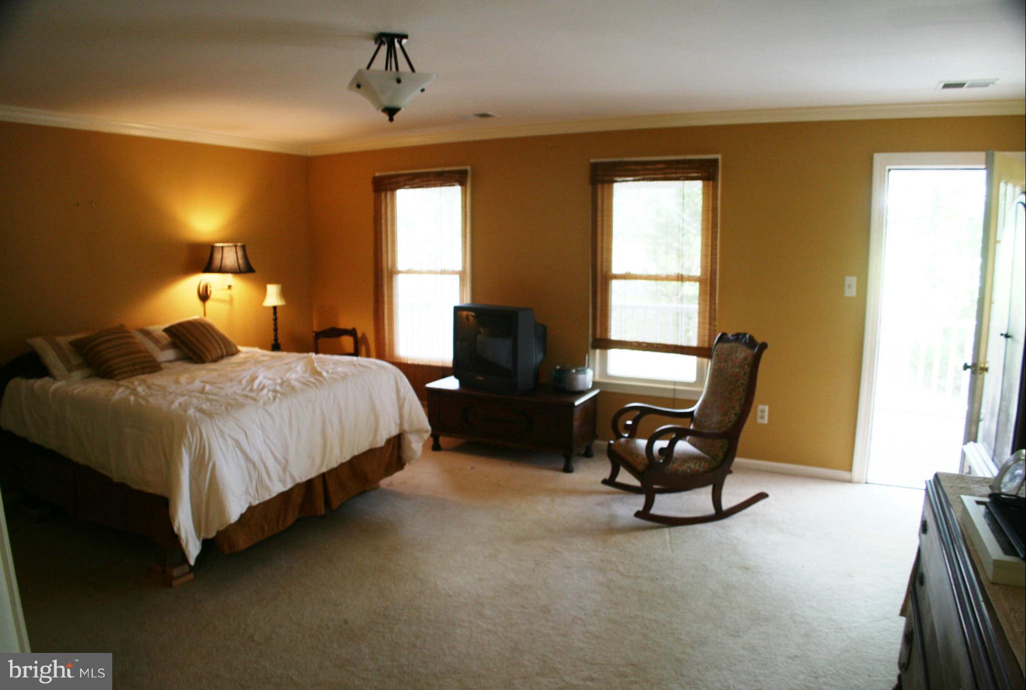 5900 Free State Road Marshall, VA 20115 - Photo 16 of 30 a bedroom with a bed windows and chair