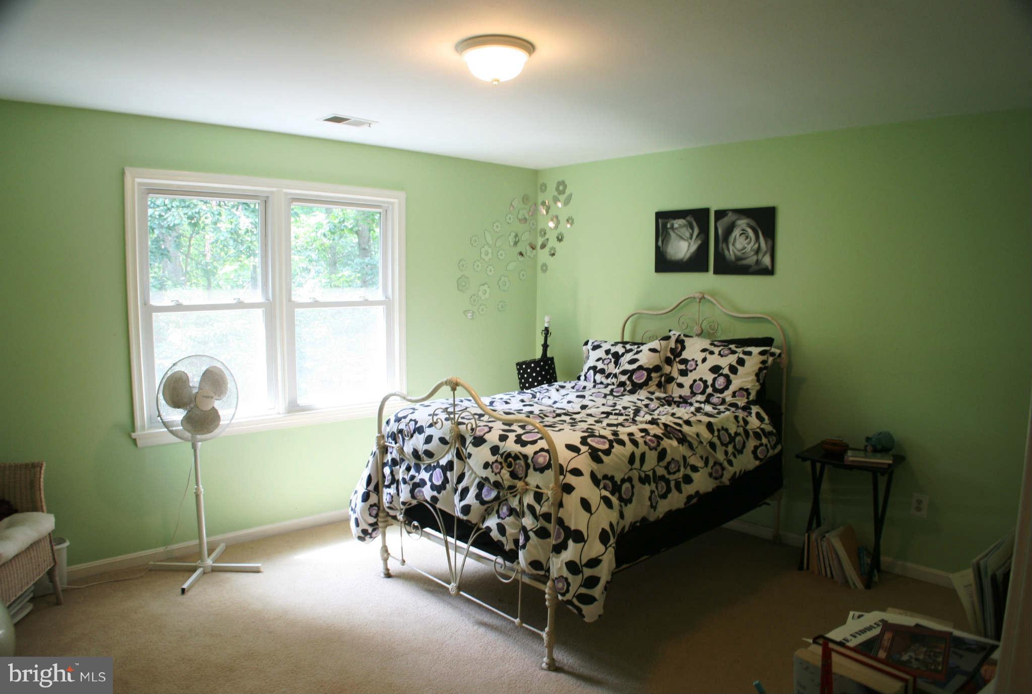 5900 Free State Road Marshall, VA 20115 - Photo 19 of 30 a bed sitting in a bedroom next to a window