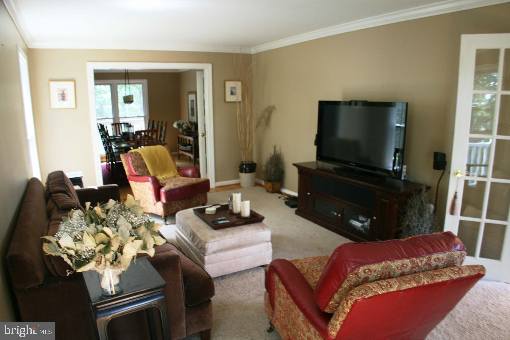 5900 Free State Road Marshall, VA 20115 - Photo 4 of 30 a living room with furniture a flat screen tv and a fireplace