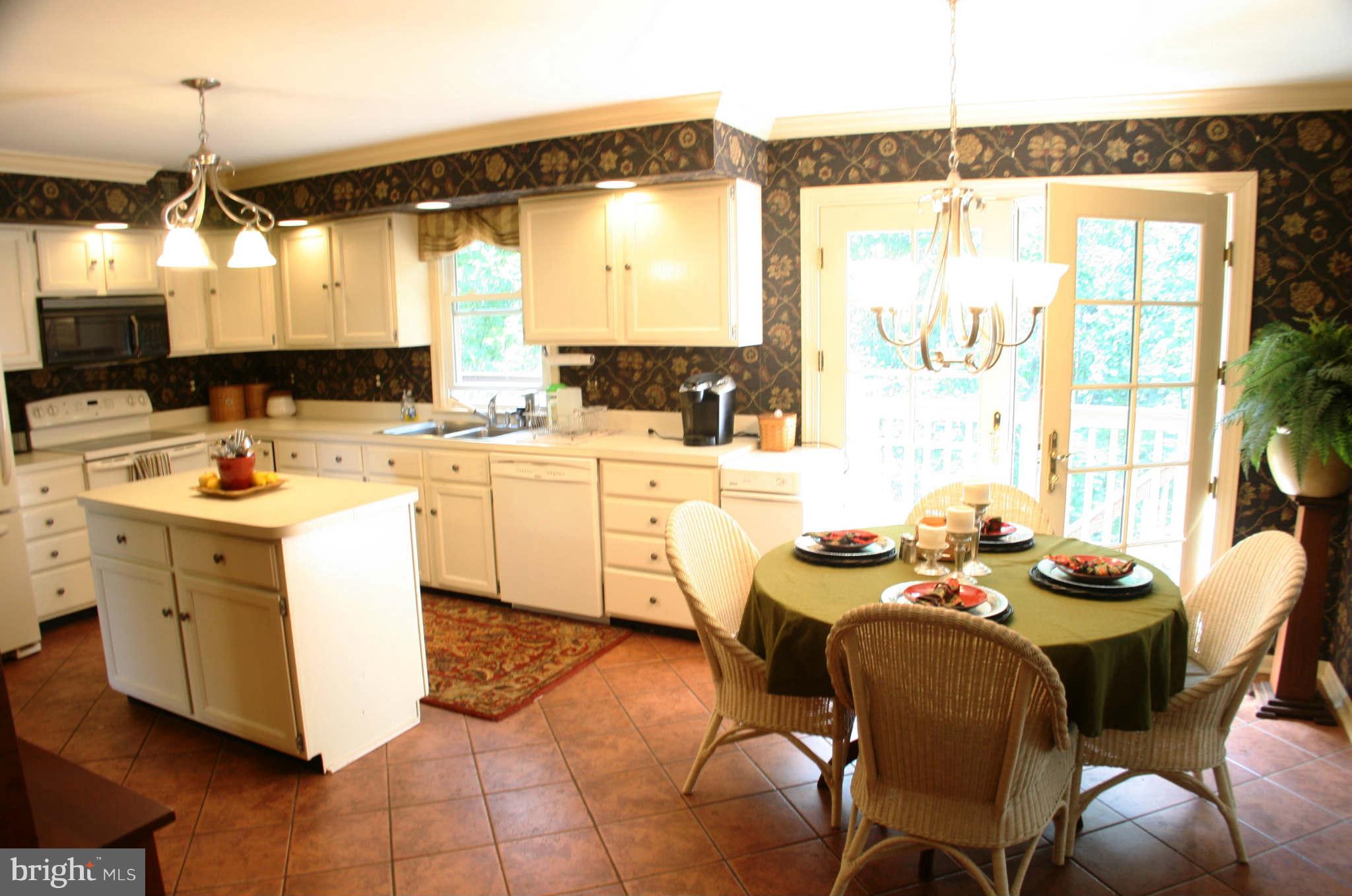 5900 Free State Road Marshall, VA 20115 - Photo 6 of 30 a kitchen that has a lot of cabinets a sink and a stove in it