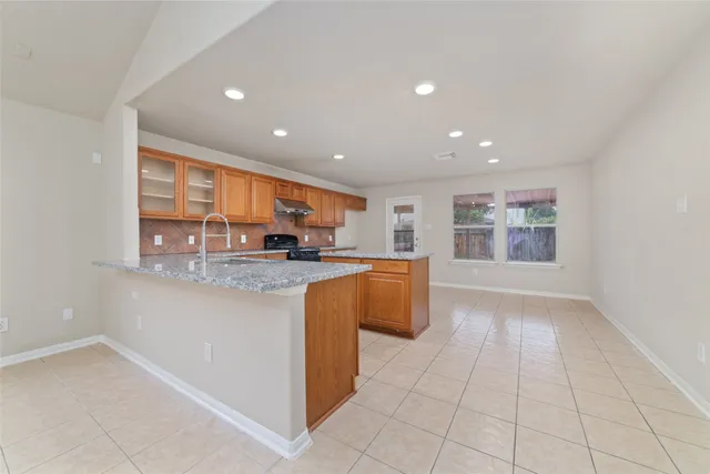 a kitchen with stainless steel appliances a refrigerator and a sink