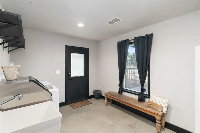 a room with gym equipment and a window