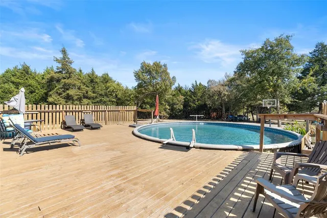 a view of a swimming pool with a patio