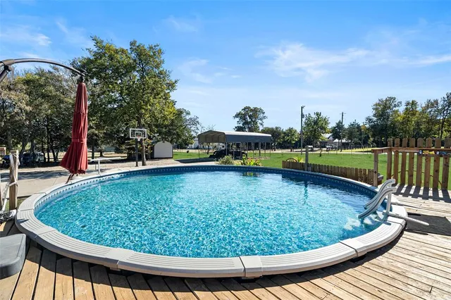 a view of a swimming pool with a outdoor seating