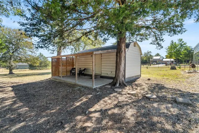 a backyard of a house with lots of green space