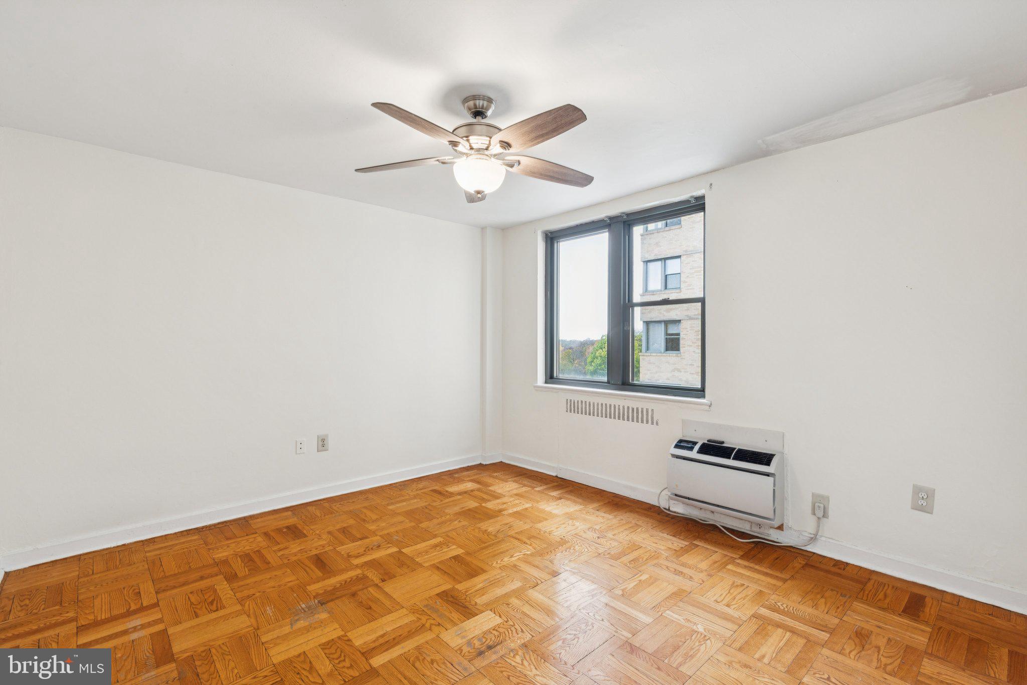 2601 Pennsylvania Avenue, Unit 449 Philadelphia, PA 19130 - Photo 12 of 18 a view of a room with a ceiling fan and a window