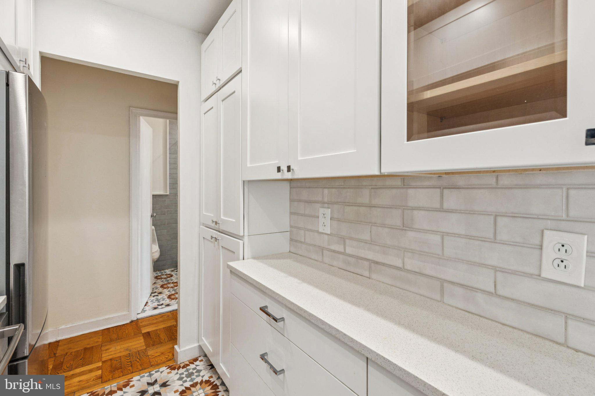 2601 Pennsylvania Avenue, Unit 449 Philadelphia, PA 19130 - Photo 4 of 18 a bathroom with a sink and cabinets