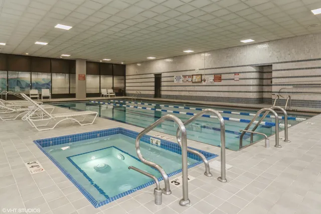 a view of a livingroom with a ceiling fan and window