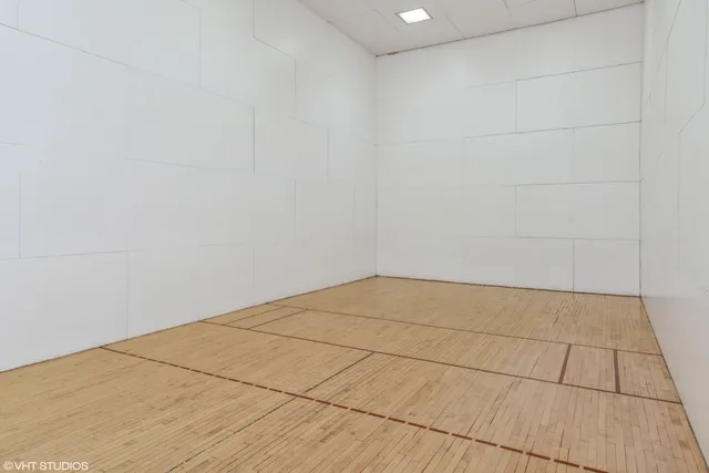 a view of a tennis court with buildings