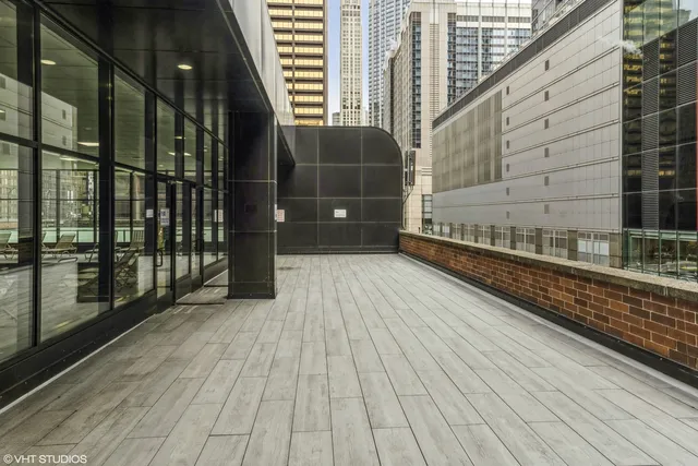 a kitchen with kitchen island a sink a stove and a refrigerator