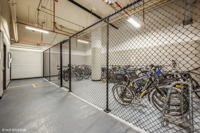 a view of parking garage with cars