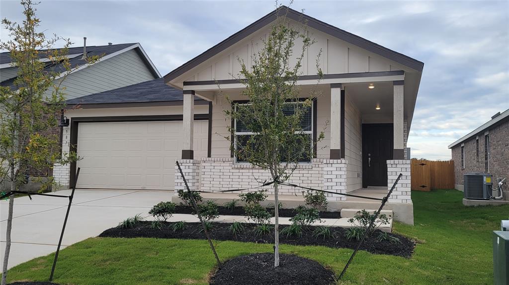 587 Avre Loop Kyle, TX 78640 - Photo 2 of 20 a front view of a house with garden