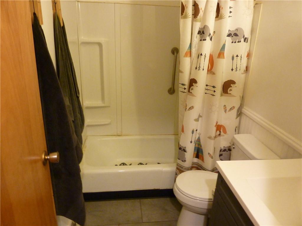 901 Prospect Road Evans City, PA 16033 - Photo 5 of 12 a bathroom with a sink toilet and shower