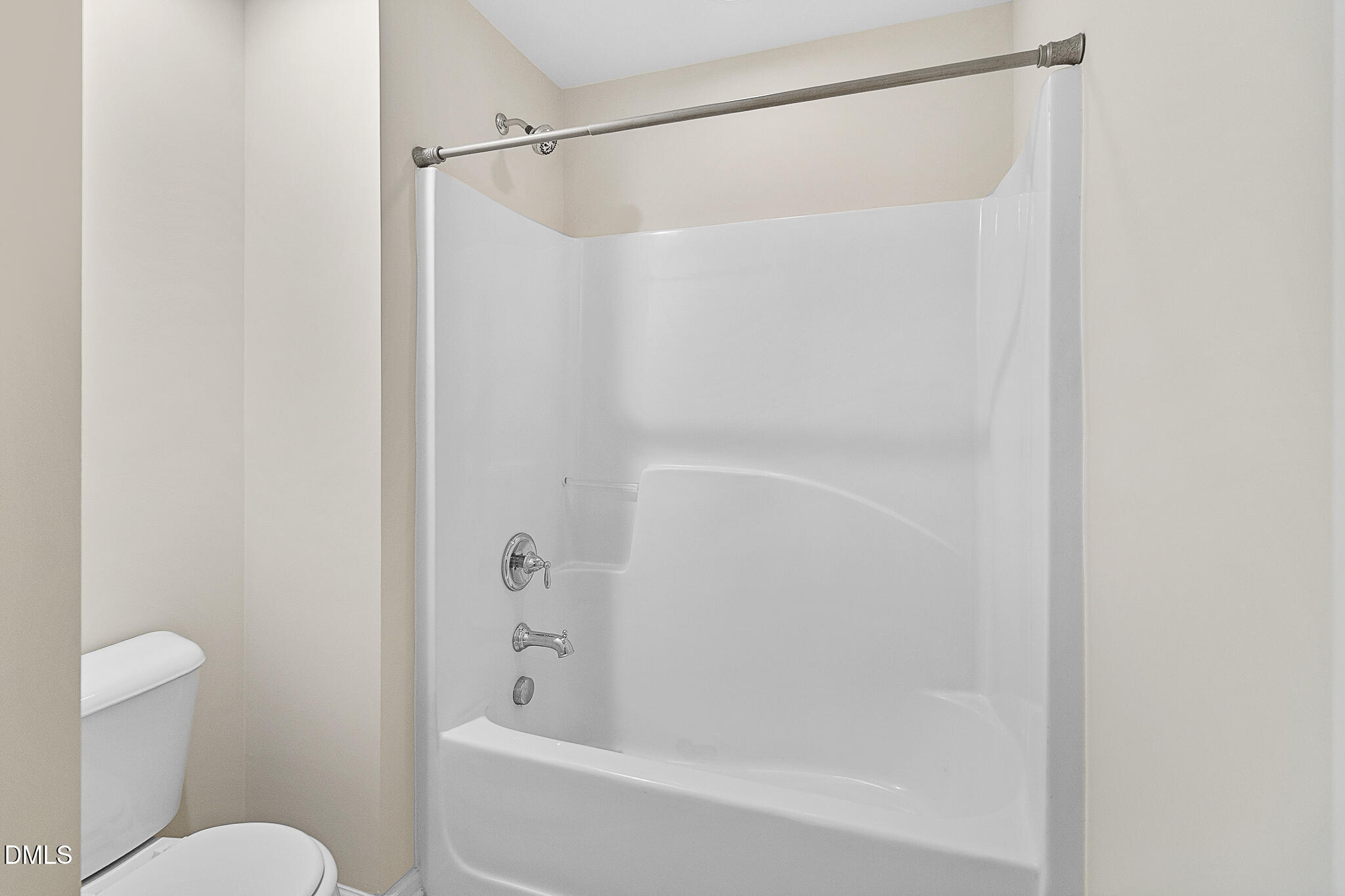 4249 Saubranch Hill Street Raleigh, NC 27616 - Photo 18 of 31 a bathroom with a bathtub and a toilet