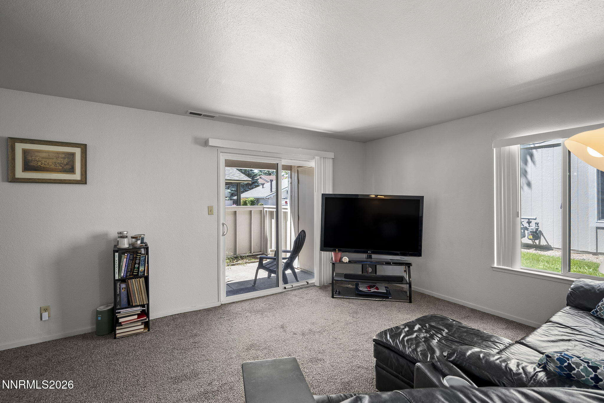 400 South Saliman Road, Unit 129 Carson City, NV 89701 - Photo 7 of 15 a living room with furniture and a flat screen tv