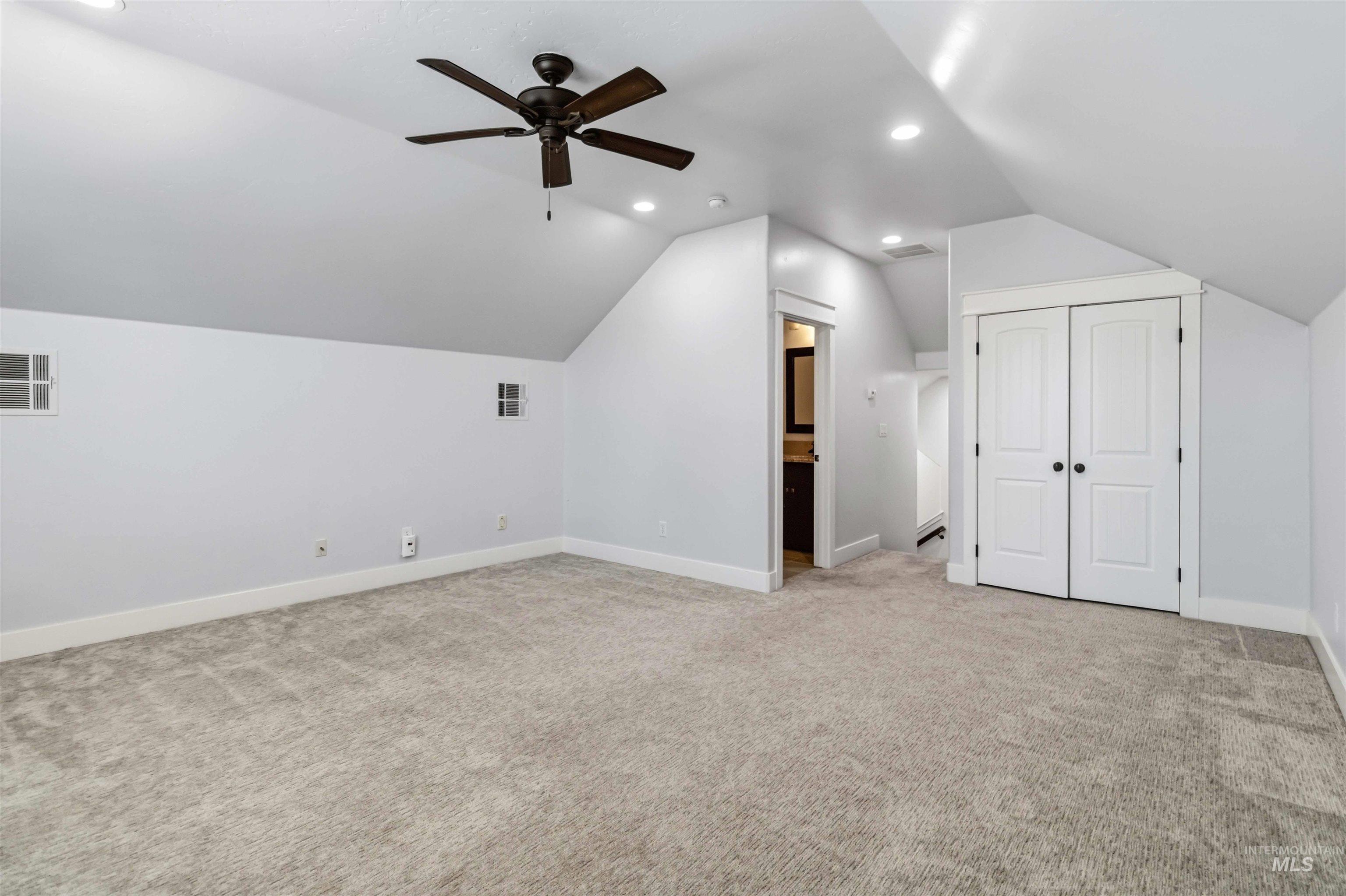 3218 North Cherry Laurel Way Star, ID 83669 - Photo 39 of 50 Spacious room featuring vaulted ceilings, recessed lighting, and a contemporary ceiling fan