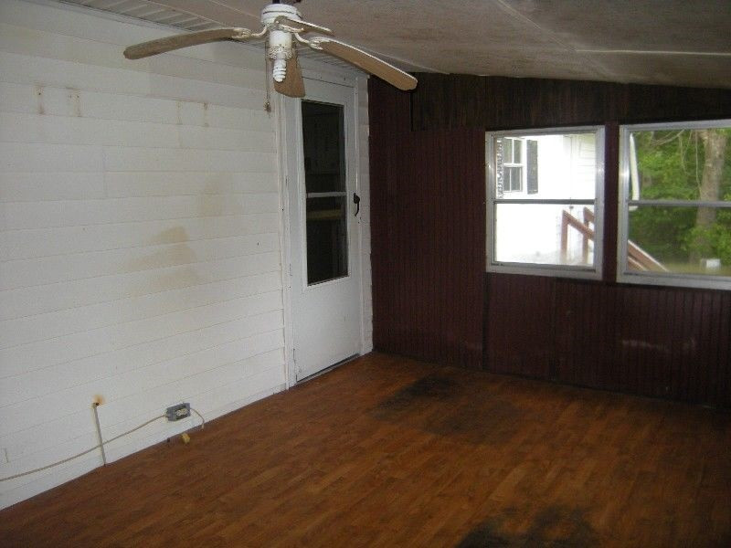 13843 Labaron Drive Willow Spring, NC 27592 - Photo 8 of 11 enclosed back porch
