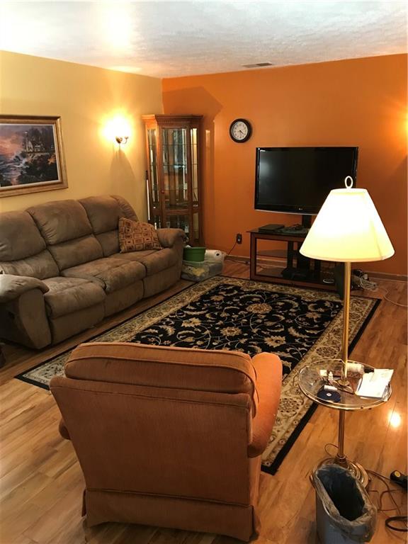 1723 Amity Ridge Road Washington, PA 15301 - Photo 2 of 25 19x13 Living room with laminated flooring.