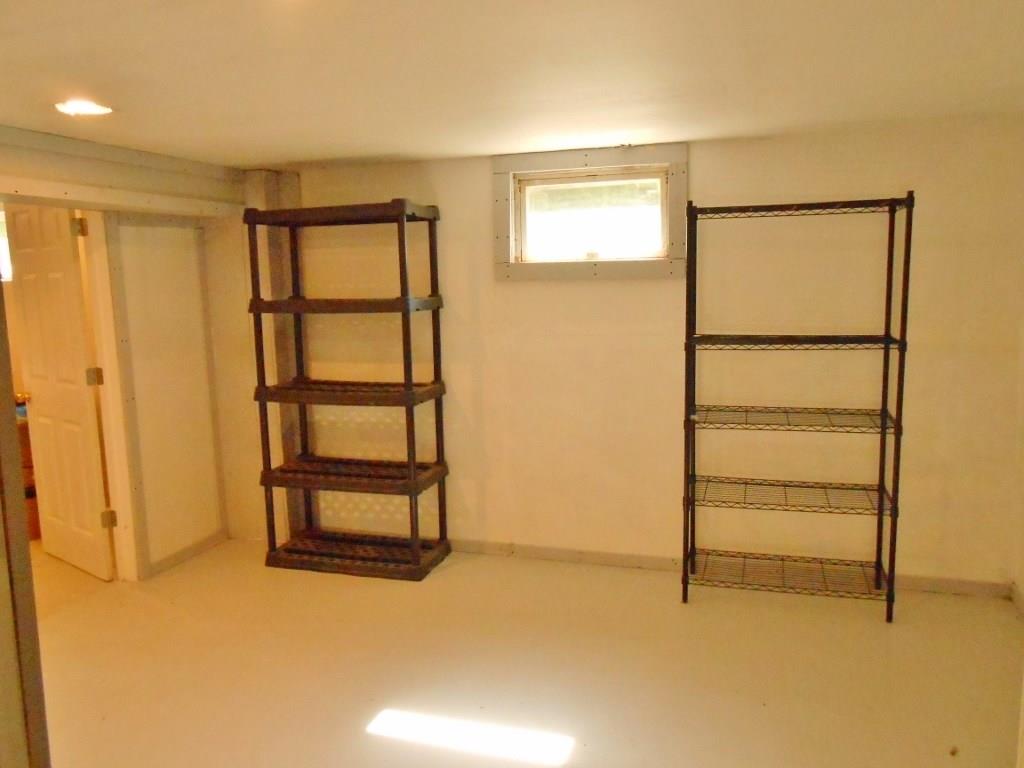 1723 Amity Ridge Road Washington, PA 15301 - Photo 14 of 25 Den or storage room in basement with exit door.