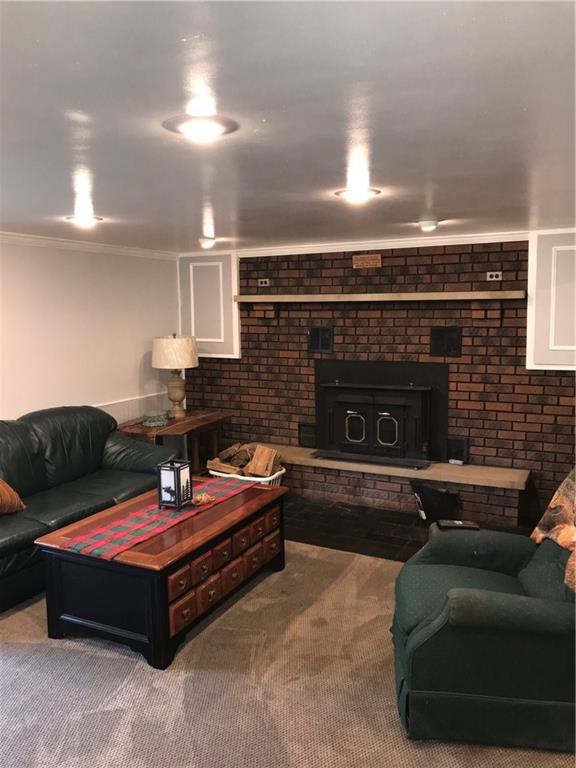 1723 Amity Ridge Road Washington, PA 15301 - Photo 17 of 25 Brick fireplace with woodstove insert in game room