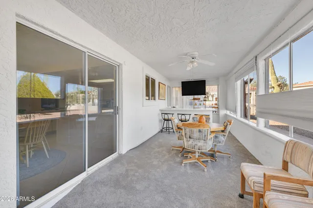 a view of a dining room with furniture a livingroom and wooden floor