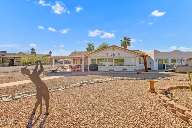 a view of a patio with a table and chairs