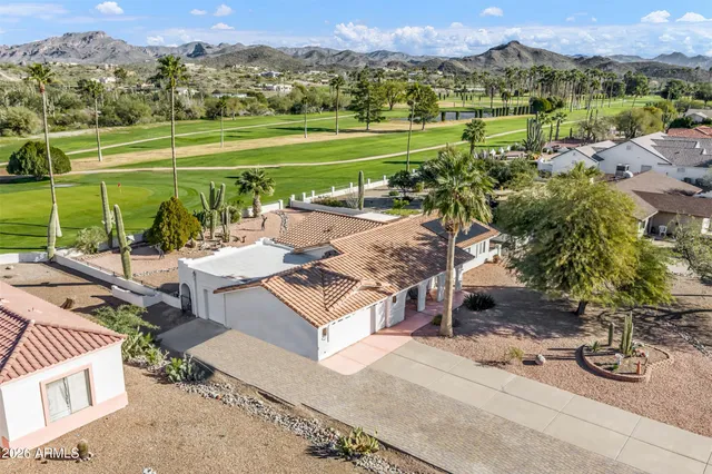 an aerial view of houses with outdoor space