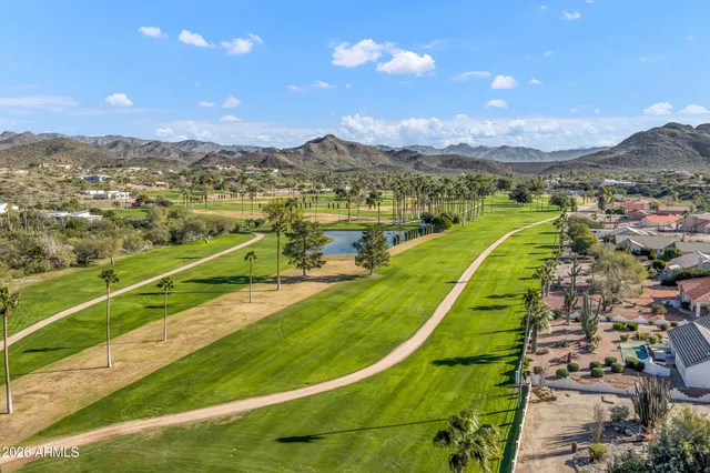 an aerial view of a house with a big yard