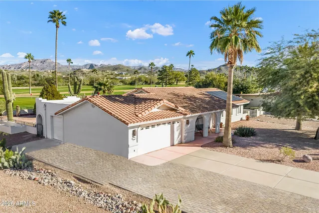 a house with a swimming pool and a yard