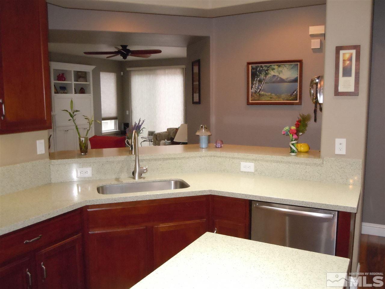 511 Beckfield Court Reno, NV 89521 - Photo 3 of 25 a kitchen with a sink and a refrigerator