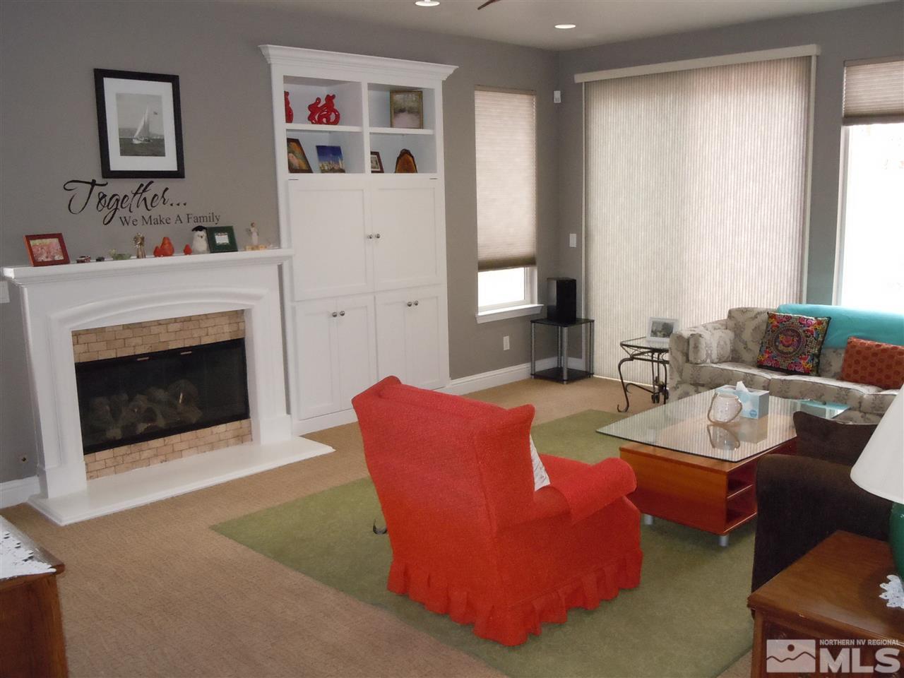 511 Beckfield Court Reno, NV 89521 - Photo 8 of 25 a living room with furniture and a fireplace