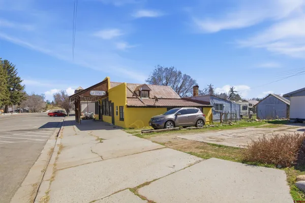 a view of a street with cars