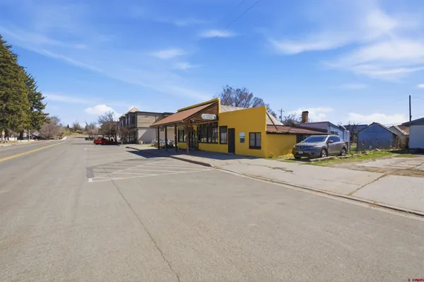 a view of a street with a building in the background