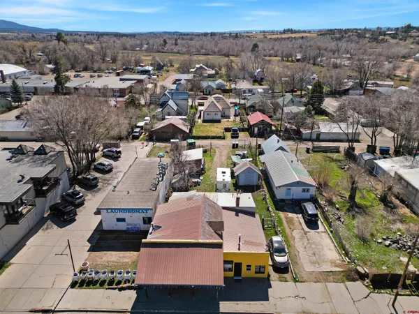 a aerial view of multi story residential apartment building with yard