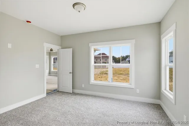 a bathroom with a sink a toilet a mirror and shower