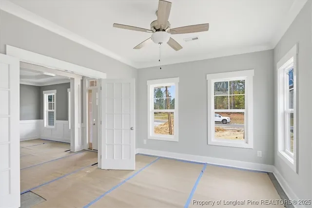 an empty room with windows and closet