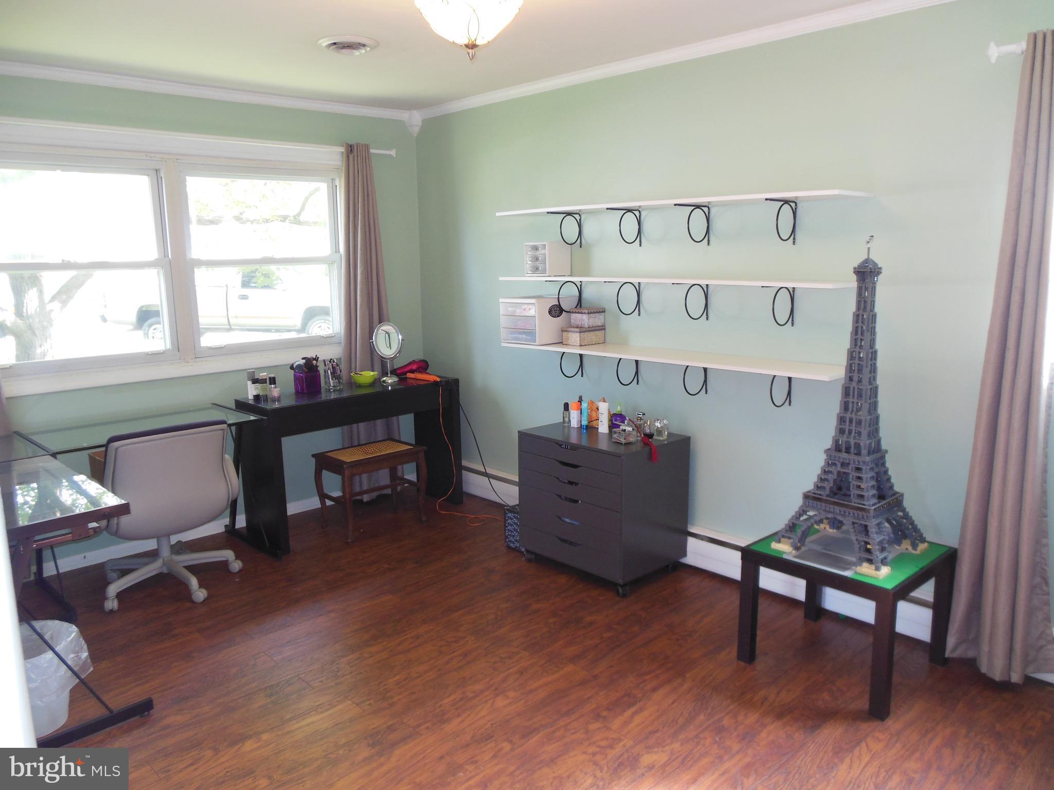 8435 Coco Road Baltimore, MD 21237 - Photo 22 of 27 a room with furniture and a wooden floor