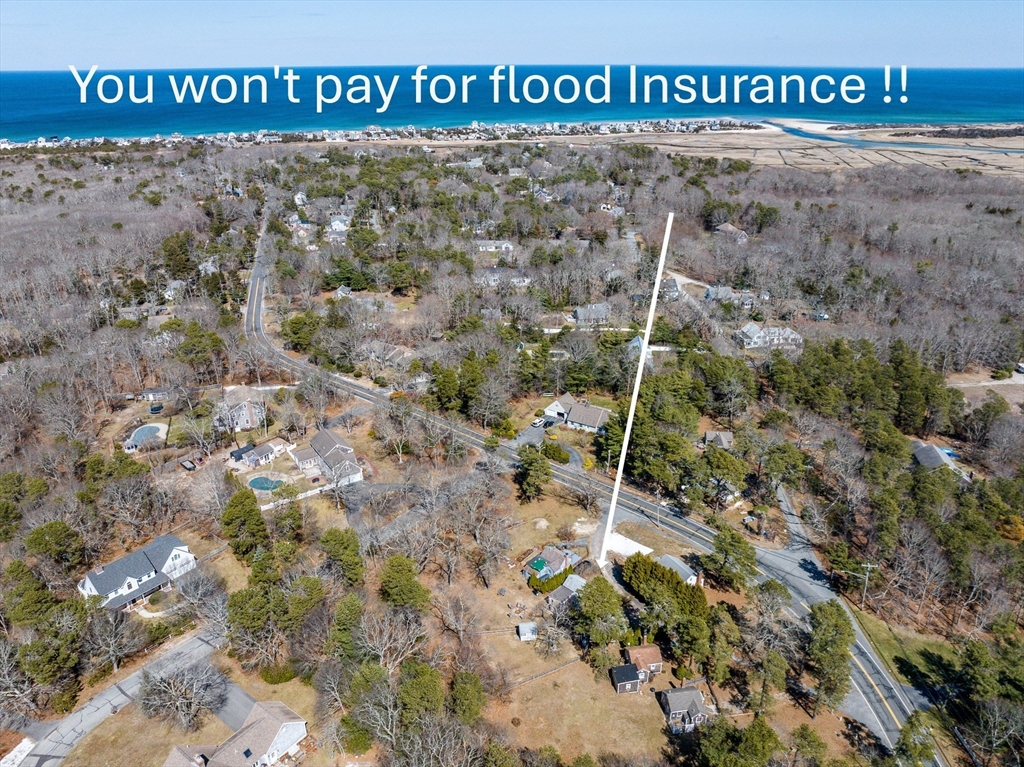 17 Ploughed Neck Road Sandwich, MA 02537 - Photo 1 of 13 a view of outdoor space with signage and flags