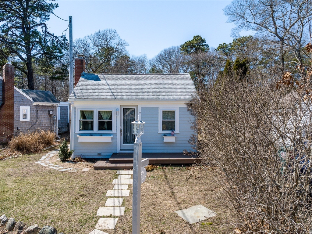 17 Ploughed Neck Road Sandwich, MA 02537 - Photo 2 of 13 a front view of a house with garden