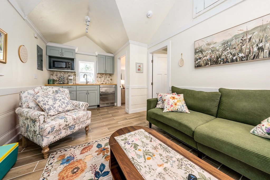 17 Ploughed Neck Road Sandwich, MA 02537 - Photo 4 of 13 a living room with furniture and a flat screen tv