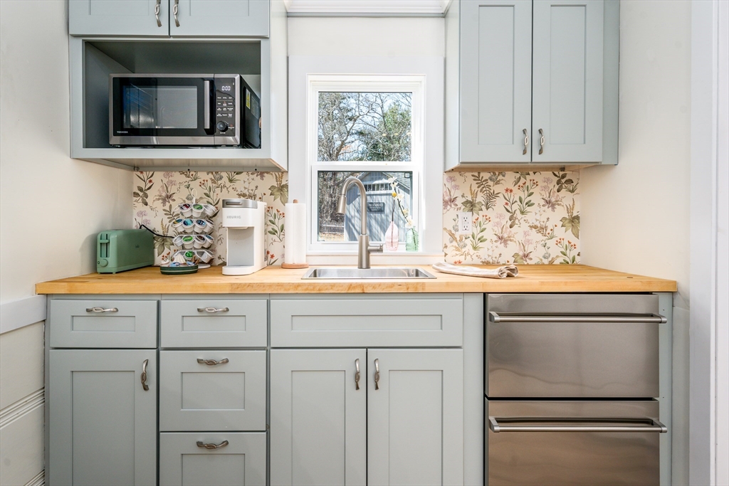 17 Ploughed Neck Road Sandwich, MA 02537 - Photo 5 of 13 a kitchen with appliances cabinets and a window